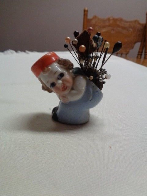 VINTAGE PORCELAIN BENDING GIRL PIN CUSHION MADE IN JAPAN IN GOOD CONDITION