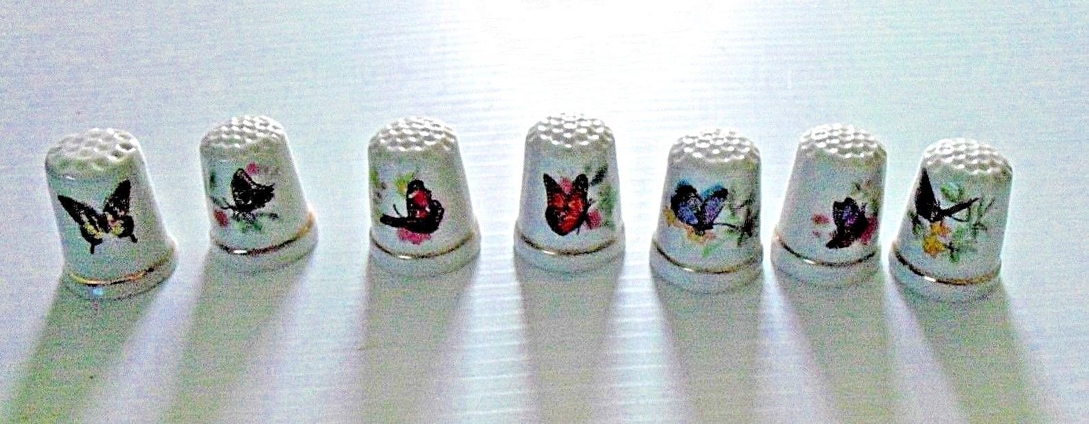 Lot of 7 Porcelain Thimble with Butterfly Pictured On It
