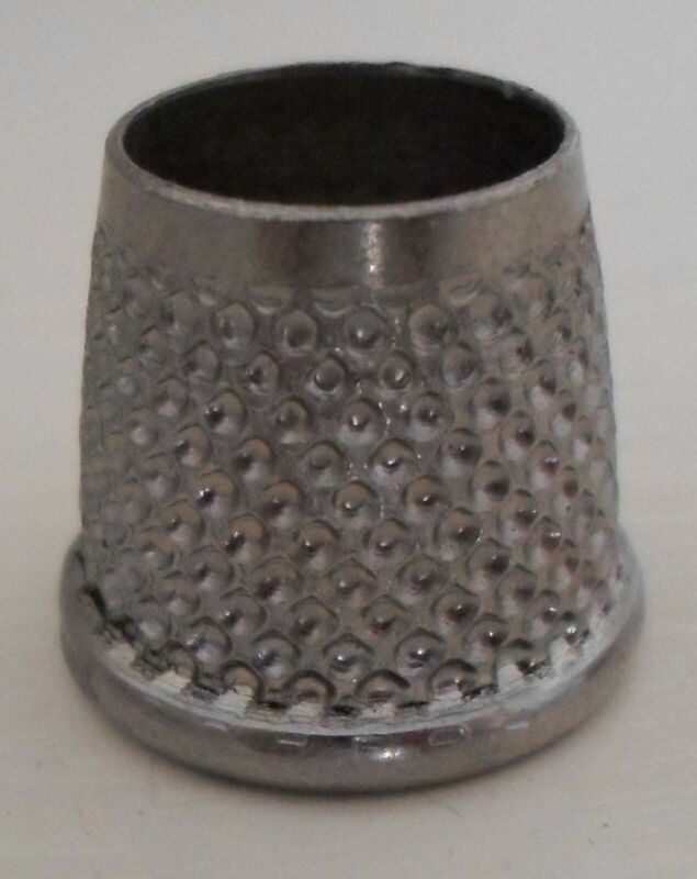 VINTAGE SILVERY THIMBLE WITH OPEN TOP