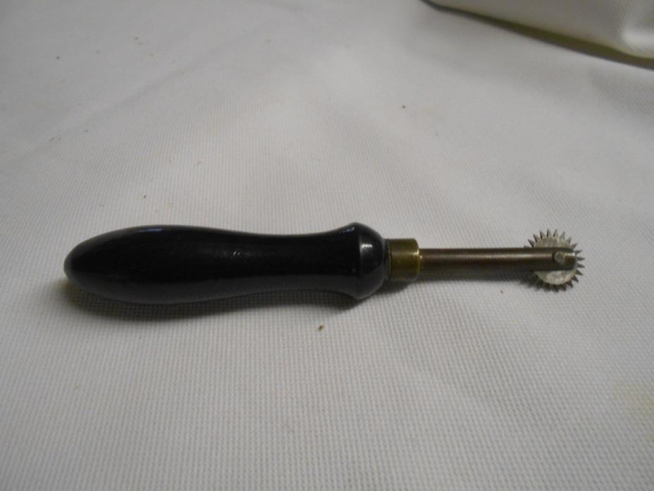 vintage brass & wood handled sewing fabric marker ? pastry cutter ?