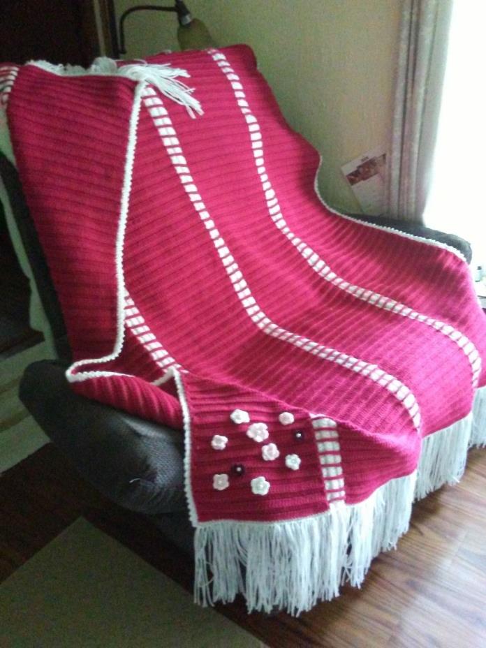 handmade crocheted afghan done in raspberry wine and white