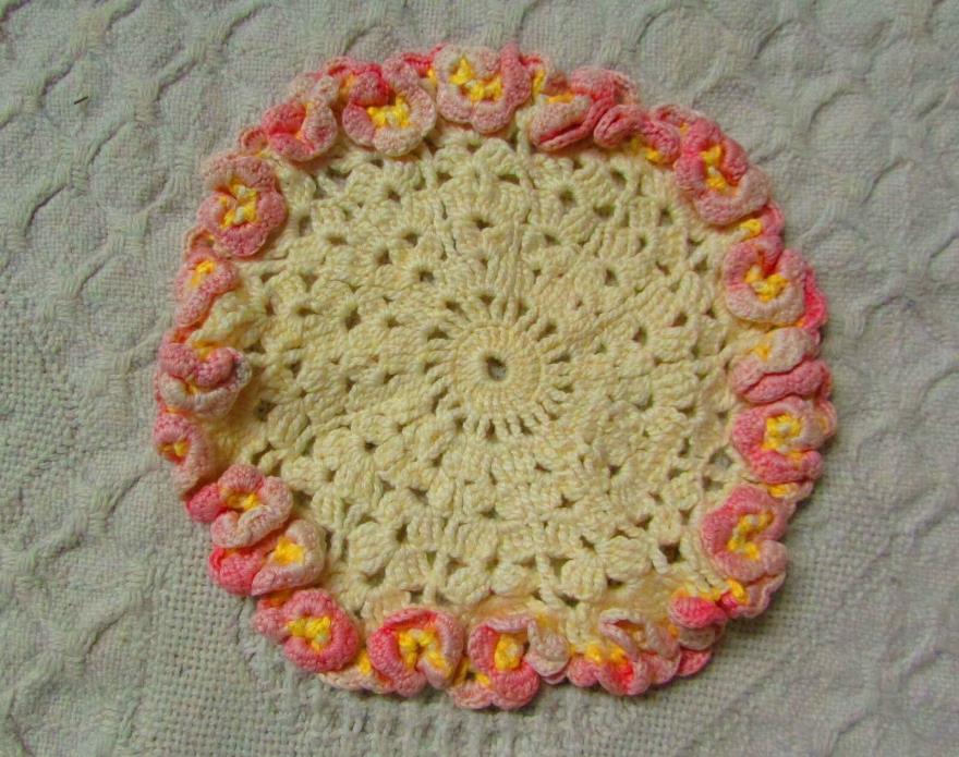 Round Doilie With Pink Flowers On Edge