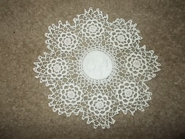 10 inch ivory colored crocheted lace doily with 2.5 inch silk center