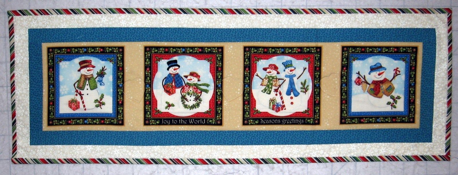 Quilted handcrafted Snowmen winter table runner 100% cotton reds, blues, tans
