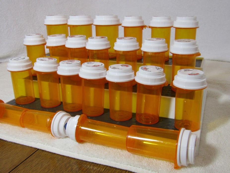 used 24 empty amber pill bottles, assorted sizes, clean, good for storage