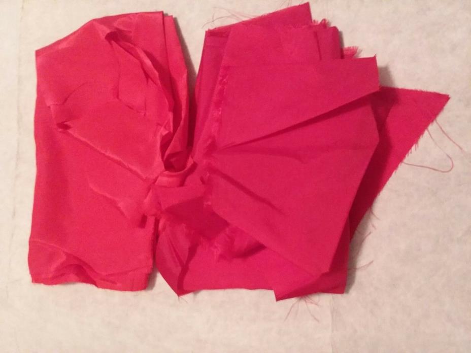 RED POLYESTER MATERIAL, SOLID MATERIAL AND PIECES, APPROXIMATELY 1/3 YARD