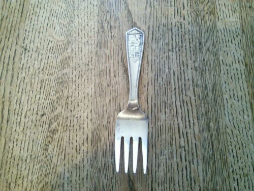 Antique Tiffany & Co. sterling silver baby fork with a queen?? eating at table