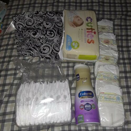 Newborn baby lot-preowned baby sling, disposable diapers and Enfamil formula