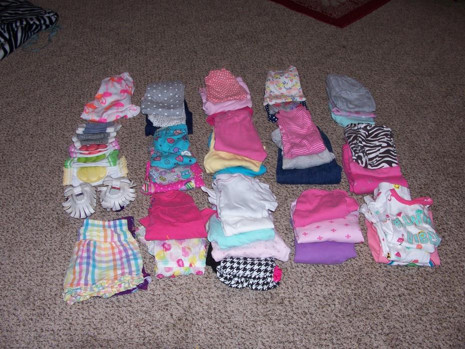 48 girls clothing sizes 9,-12 months lot