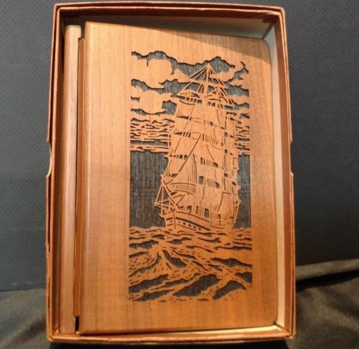 NIB laser works walnut address book carved with sailing ship design