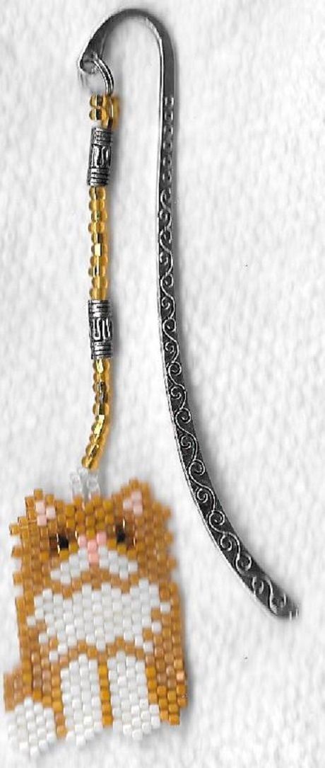 A pair of hand beaded Tan and white Persain bookmark with silver like metal hook
