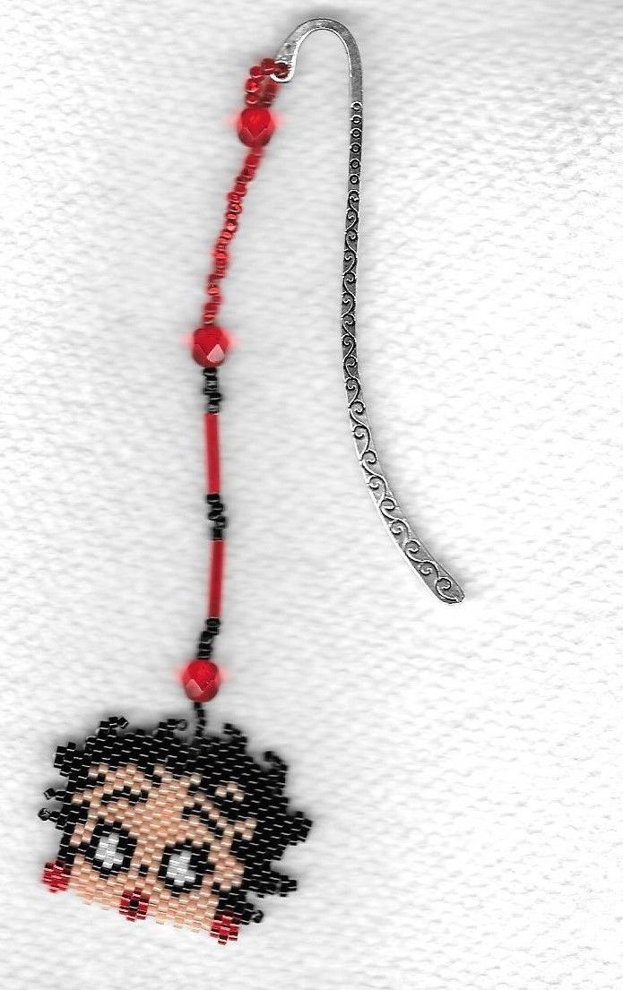 A  hand beaded Betty Boop Head bookmark with silver like metal hook