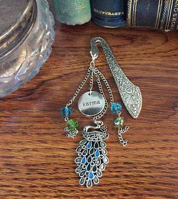 Karma is a Peacock on Ornate Silver Finish Bookmark with Blue & Green Swarovski