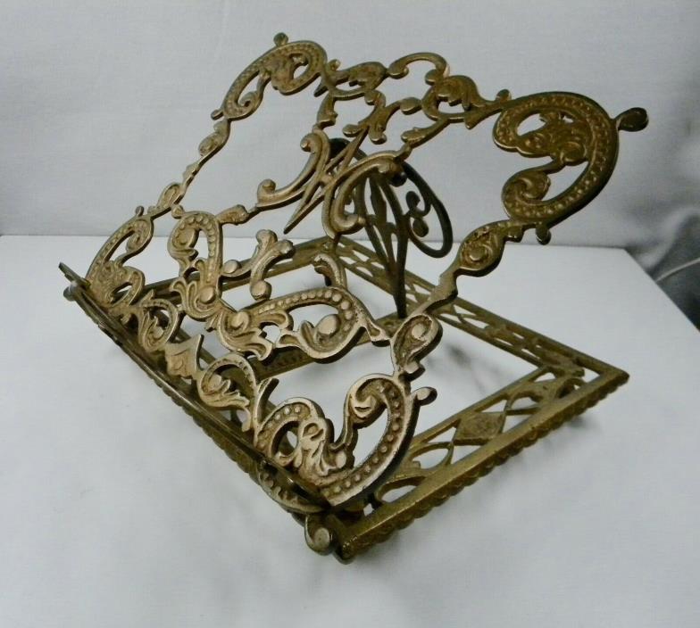 Cast brass book stand.
