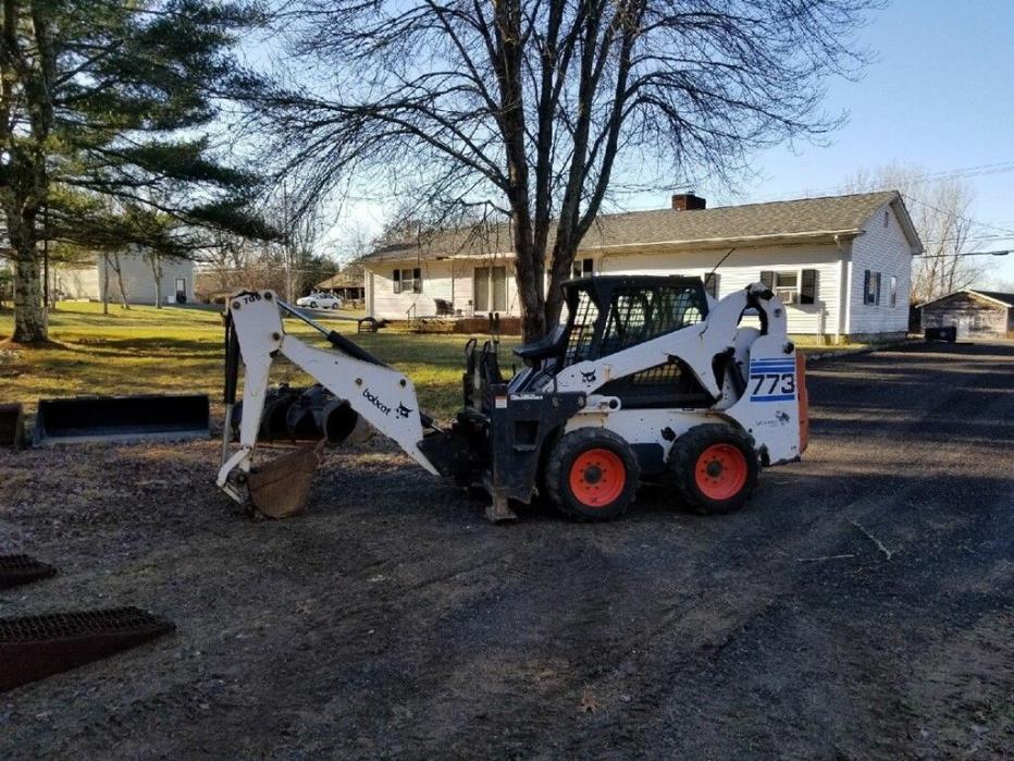773 BOBCAT PACKAGE (INCLUDING MISC. ATTACHMENTS + TRAILER)