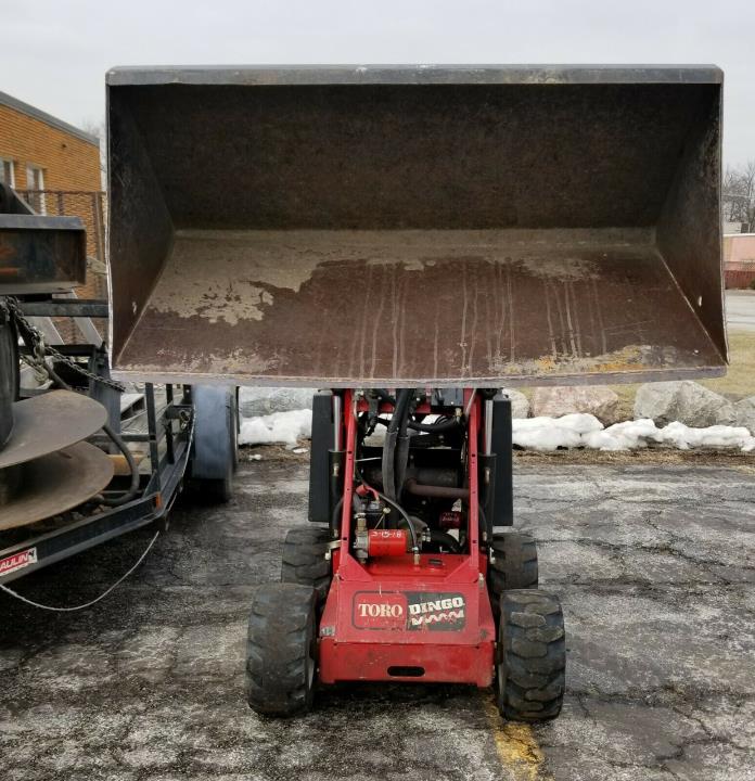 Toro 322 Dingo Mini Skid Steer Loader with custom trailer and attachments
