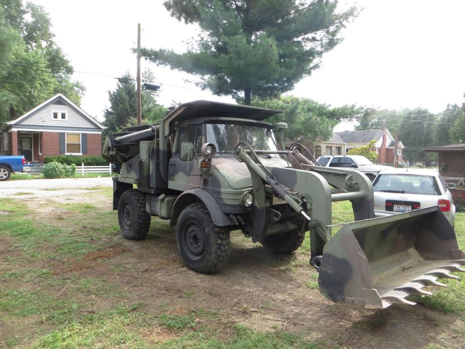 Militery Vehicle 2005 MERCEDES UNIMOG WITH THE BACKHOE AND BUCKET OPTIONS.