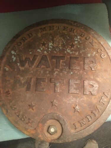Vintage castiron ford water meter lid