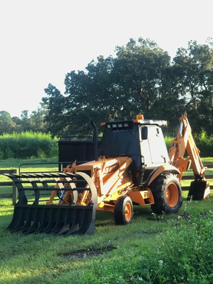 Case 580k Backhoe with grapple