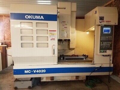 USED OKUMA MC-V4020 CNC VERTICAL MILL 2004 OSP-E100L 15000 RPM TSC Chip 20 Tools