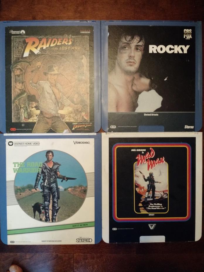 4 LOT CED VIDEODISC  ROCKY, MAD MAX, & THE ROAD WARRIOR, RAIDERS OF THE LOST ARC