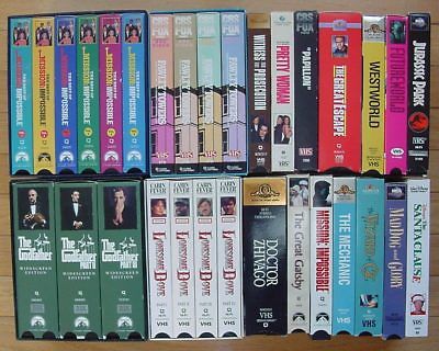 Box of VHS tapes. Several box sets, includes Fawlty Towers, Godfather Trilogy