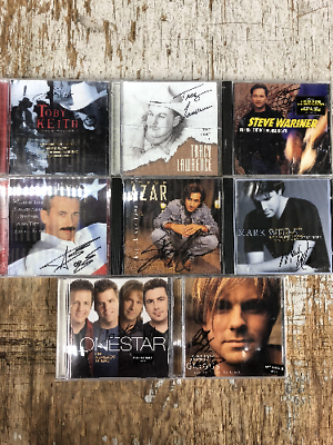 8 Signed CD's All Country Music Greats. No COA available.