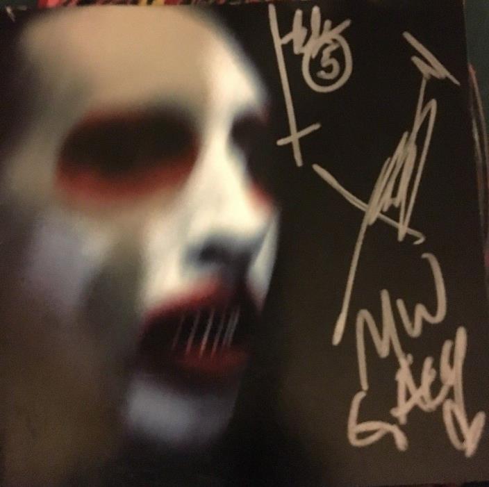 Marilyn Manson autographed the golden age of grotesque whole band with John 5