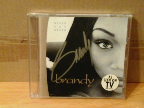R&B SINGER BRANDY NORWOOD AUTHENTIC SIGNED NEVER SAY NEVER CD BOOKLET WITH COA!!