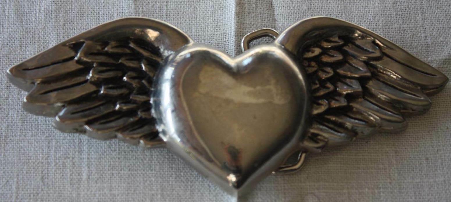 VINTAGE METAL BELT BUCKLE SILVER STAR WINGED HEART MARKED MADE IN THE USA 2004