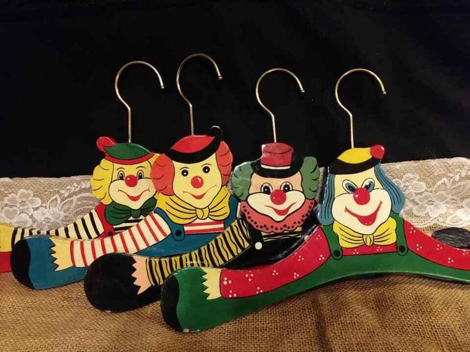 Vintage Beautiful  4 Clown Hangers made of wood and hand painted. RARE!