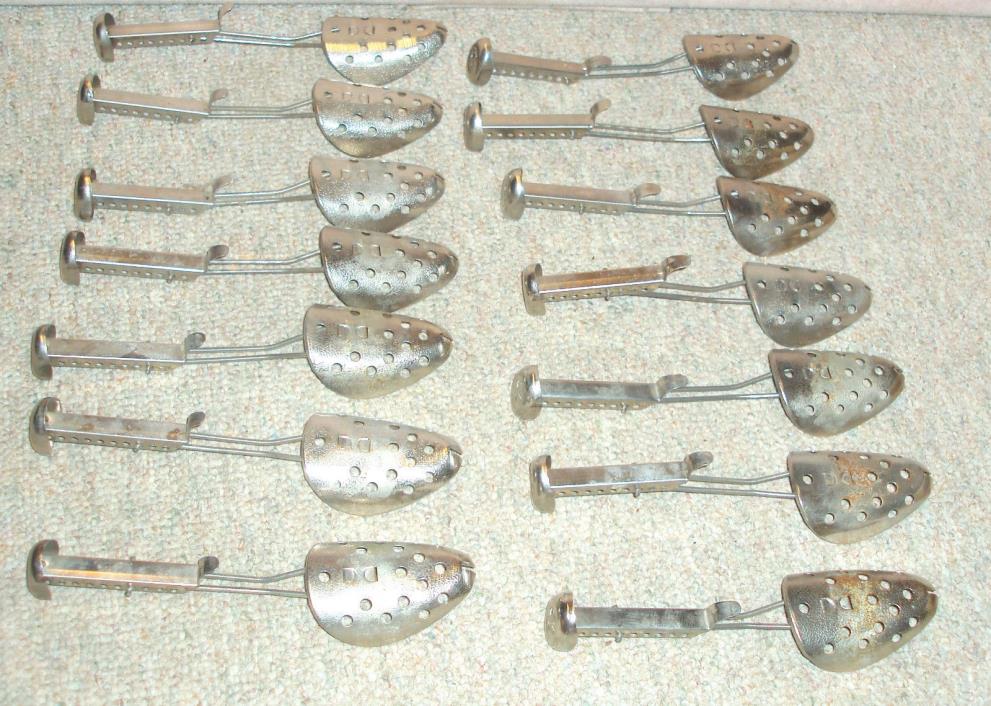 7 pair of vintage EKCO  hammered metal shoe stretchers