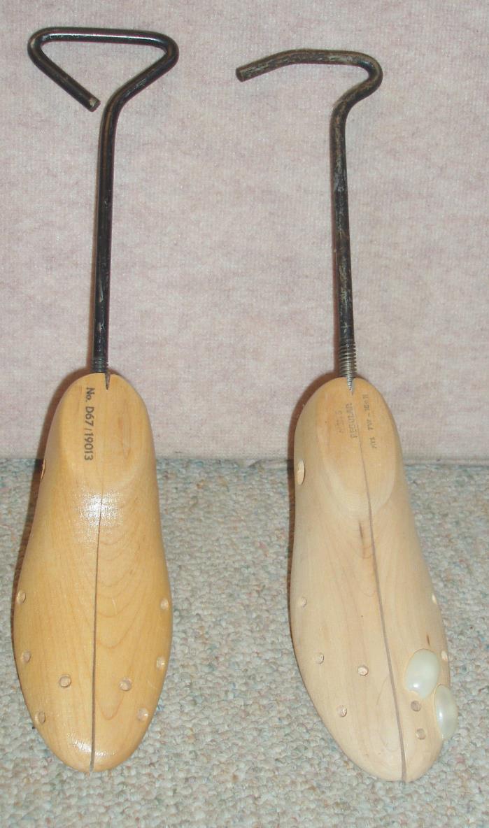 Two wooden & metal shoe stretchers.
