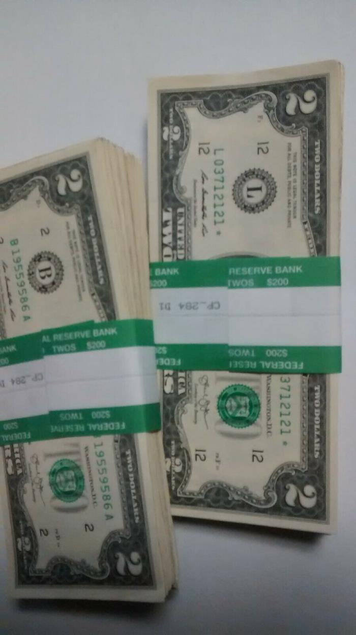 2 dollar bills-Crisp and Clean Guaranteed.  I do not sell damaged bills.