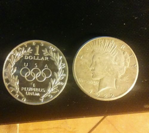 1922 peace dollar and 1988 a Olympiad liberty. Silver coins