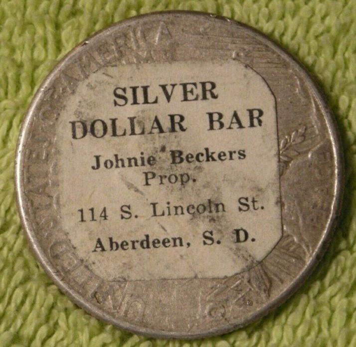 Silver Dollar Bar sticker dollar on 1922 Peace dollar Aberdeen South Dakota
