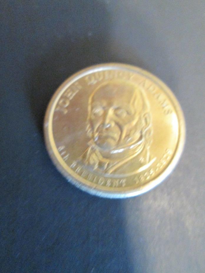 Gold colored $1.00 coin - John Quincy Adams