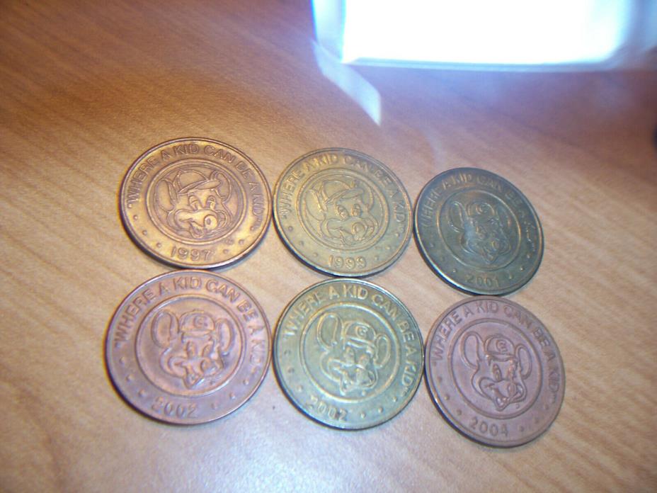 Lot of 6 Chuck E Cheese arcade game tokens 1997 99 2001 02 04 Where a kid can be