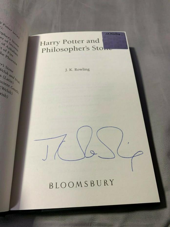 HARRY POTTER and PHILOSOPHERS STONE signed by J.K. ROWLING, 1st print, hologram