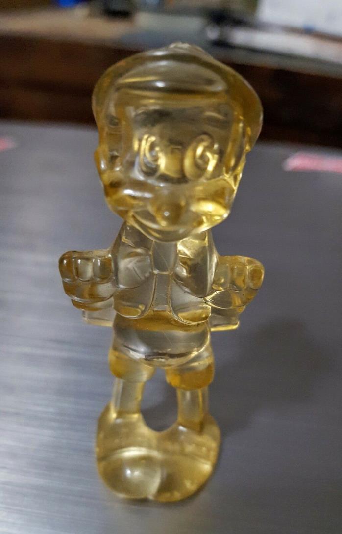 clear resin lucite amber colored pinocchio figure