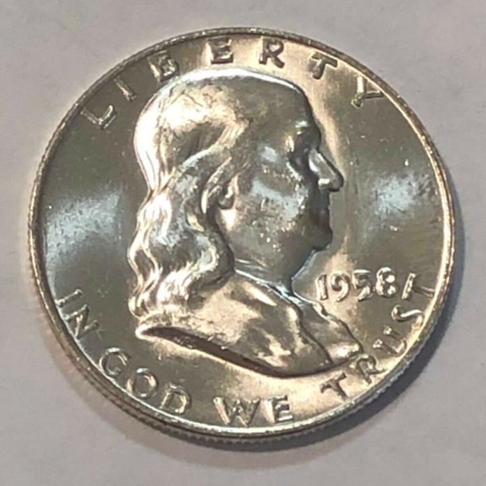 1958-D white choice BU Franklin silver half dollar.