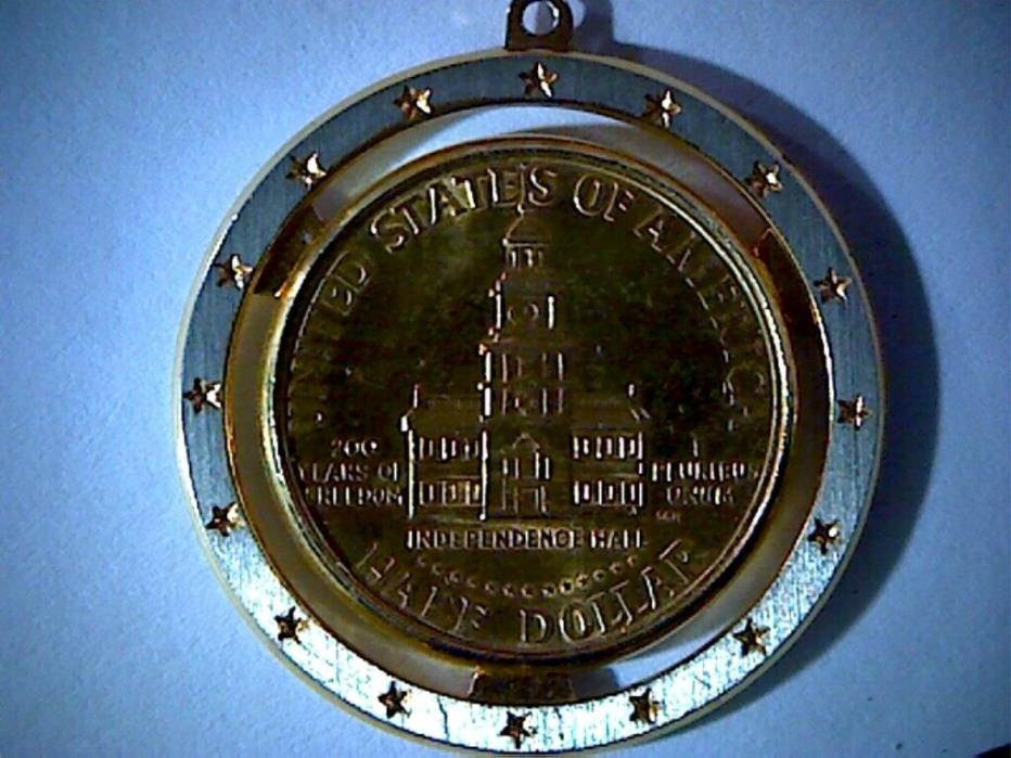 GOLD COLORED KENNEDY HALF DOLLAR COIN IN A BEZEL, COIN NECKLACE, BICENTENNIAL
