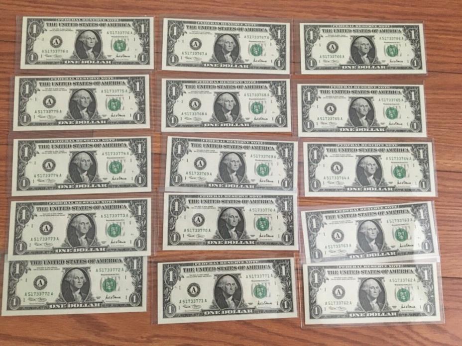 15 uncirculated dollars bills in plastic