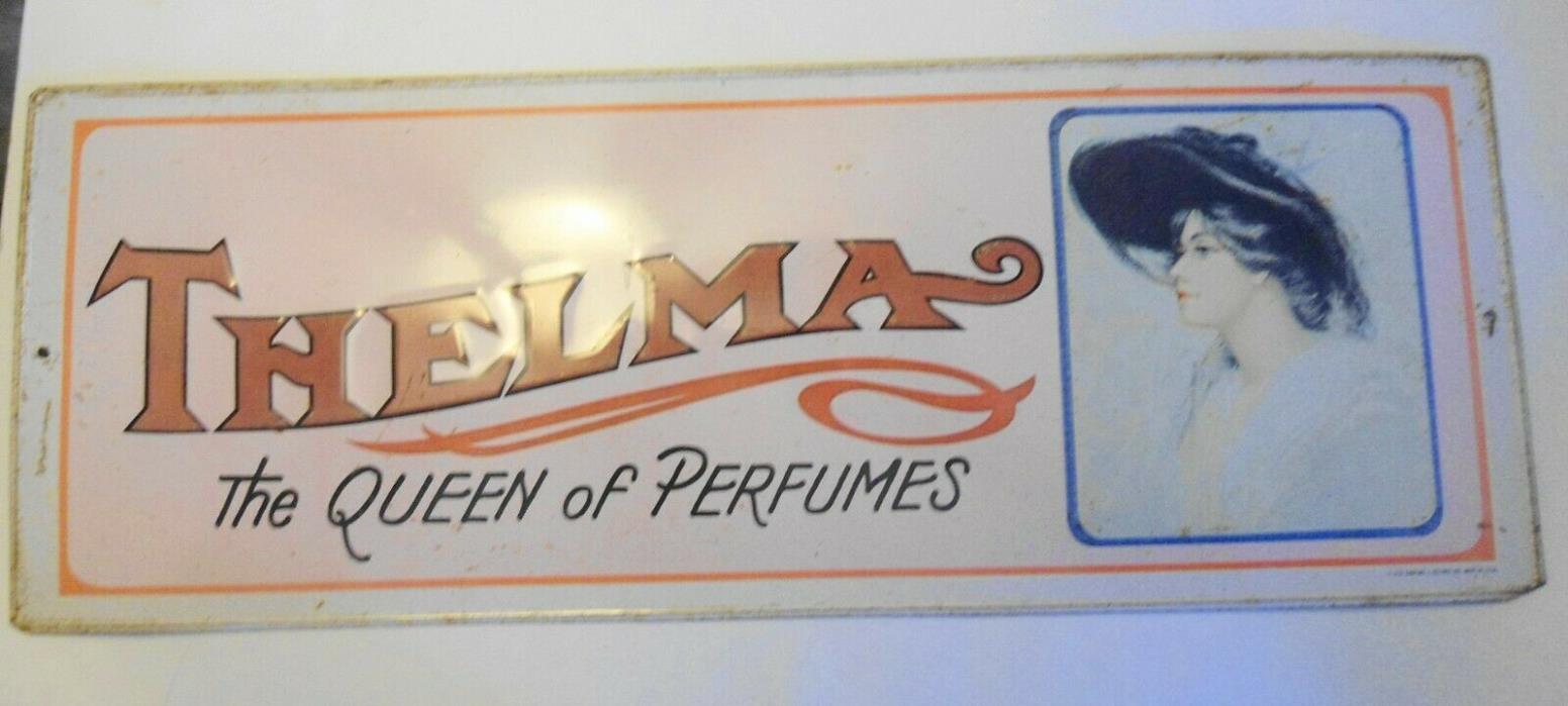 Tin Sign THELMA Vintage 1974 The Queen of Perfumes Metal Litho Embossed 19 x 7