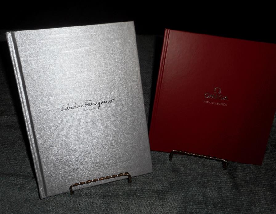 LOT 2 SALVADORE FERRAGAMO & OMEGA CATALOG HARD COVER BOOKS