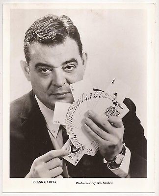 PROMOTIONAL PHOTO OF FRANK GARCIA with four aces card fan.