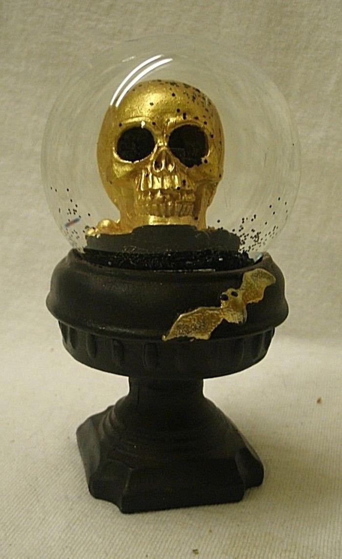 Skull Snow Globe on Pedestal Base gold & black glass & resin bat accent skulls