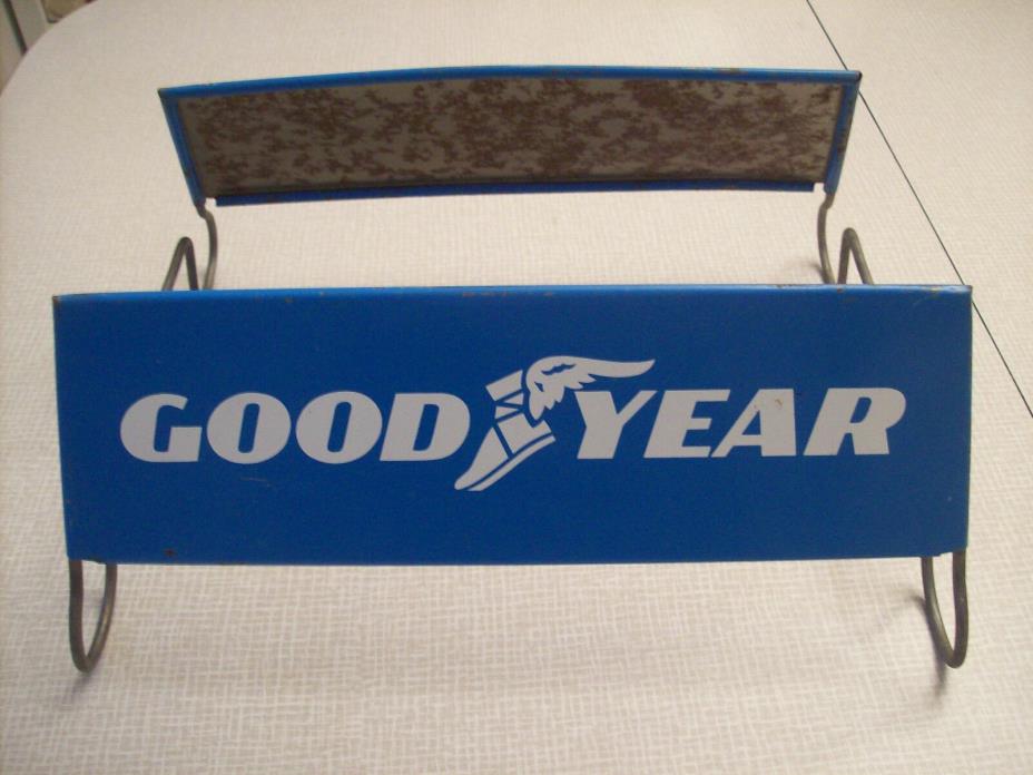 Goodyear tire stand, wing foot, vintage tire shop advertising