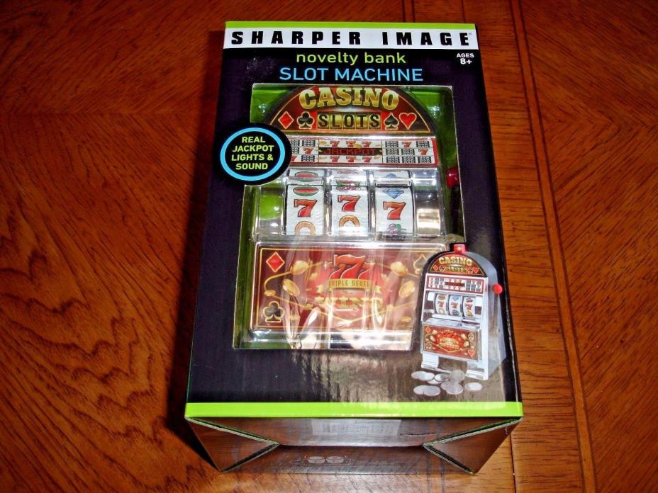 New in Box Sharper Image Novelty Slot Machine Bank Real Jackpot Lights & Sounds