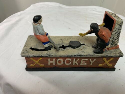 Cast Iron Mechanical Spring Loaded Hockey Themed Coin Bank Vintage GOOD